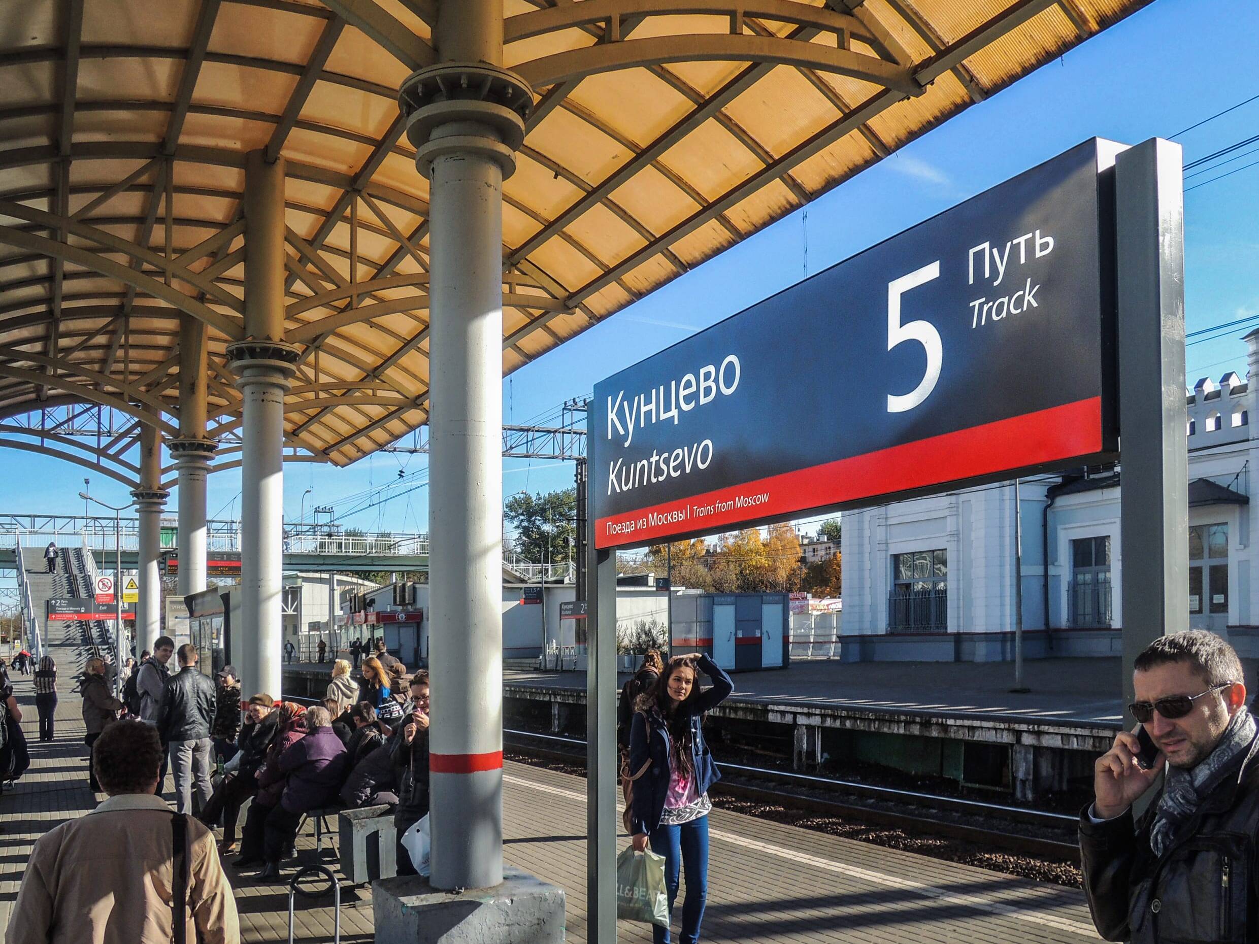 Station signage in three-colour red grey white palette for 11,000 stations &mdash; Russian Railways national wayfinding system, Air Design