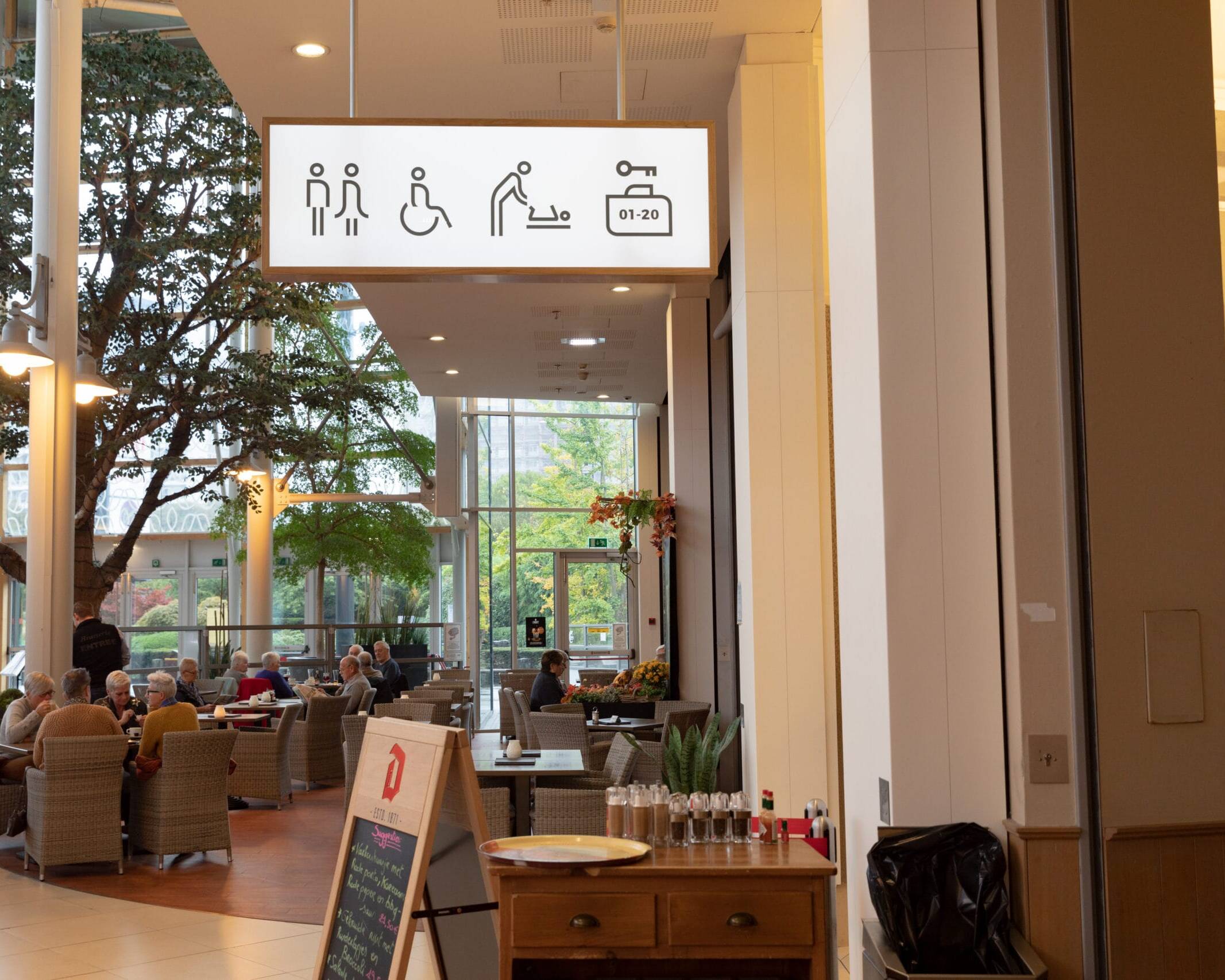 Wayfinding signage and interior design in renovated shopping centre &mdash; Waasland, Belgium, Air Design