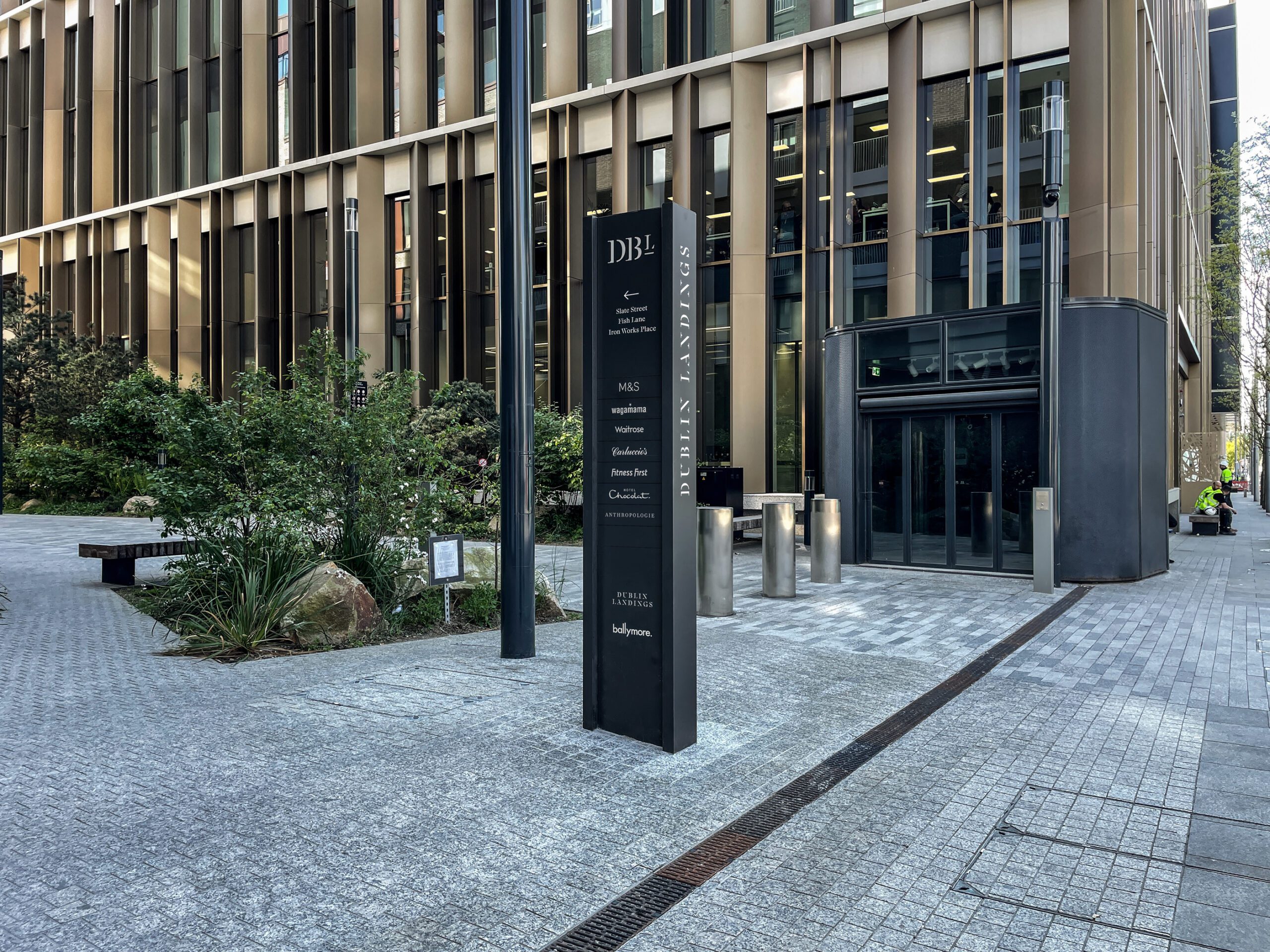 Heritage-inspired wayfinding system referencing dockside industrial history — Dublin Landings mixed-use development, Ballymore, Dublin Docklands, Air Design